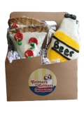 Dog treats shaped like a bottle and a pizza in a box with Fritters n' Critters branding.